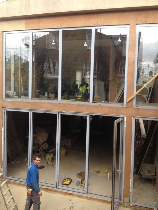 Aluminium bi-fold doors with two-storey glazing in Waltham Abbey